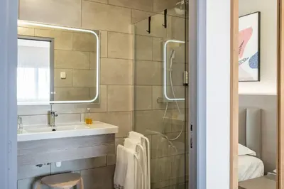 Salle de bains dans l'établissement Hotel Tambourin