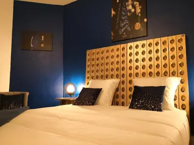 Un ou plusieurs lits dans un hébergement de l'établissement Groom Epernay - Jacuzzi & Champagne