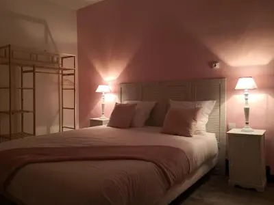 Un ou plusieurs lits dans un hébergement de l'établissement Groom Epernay - Jacuzzi & Champagne