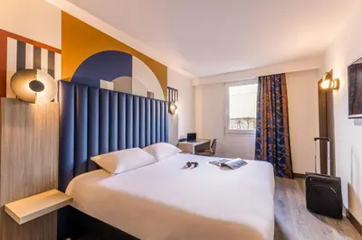 Un ou plusieurs lits dans un hébergement de l'établissement ibis Styles Saint-Quentin