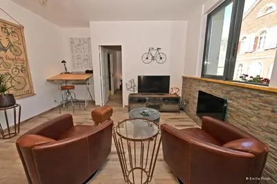 Coin salon dans l'établissement Gite Motobecane