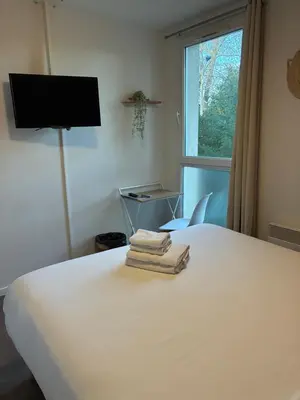 Télévision ou salle de divertissement dans l'établissement Hotel Au Bon Sejour