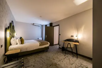 Un ou plusieurs lits dans un hébergement de l'établissement Best Western Le Relais du Vigneron