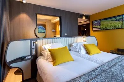 Un ou plusieurs lits dans un hébergement de l'établissement Best Western Premier Hotel de la Paix