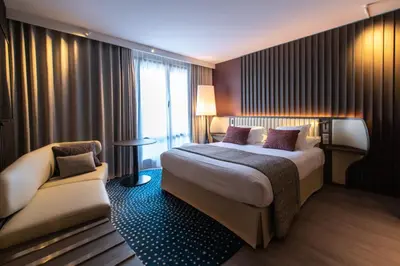 Un ou plusieurs lits dans un hébergement de l'établissement Best Western Premier Hotel de la Paix