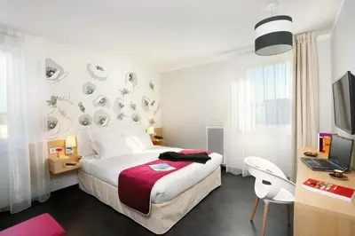 Un ou plusieurs lits dans un hébergement de l'établissement Appart'City Classic Reims Parc des Expositions