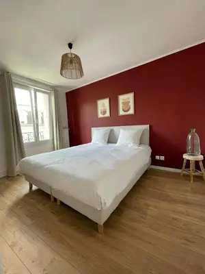 Un ou plusieurs lits dans un hébergement de l'établissement Le W - Appart vintage