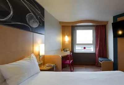 Un ou plusieurs lits dans un hébergement de l'établissement B&B HOTEL Reims Centre Erlon