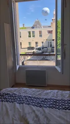 Un ou plusieurs lits dans un hébergement de l'établissement Appartement Aventure à Épernay
