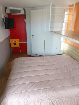 Un ou plusieurs lits dans un hébergement de l'établissement FASTHOTEL Reims Est - Taissy