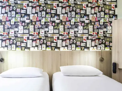 Un ou plusieurs lits dans un hébergement de l'établissement Ibis Styles Reims Centre Cathédrale