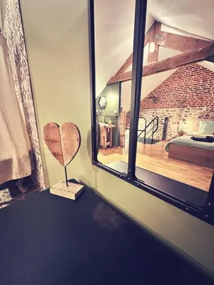 Un ou plusieurs lits dans un hébergement de l'établissement Le Loft