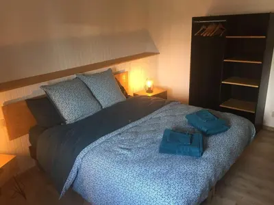 Un ou plusieurs lits dans un hébergement de l'établissement Gîte 8 à 14 personnes en Champagne avec jacuzzi