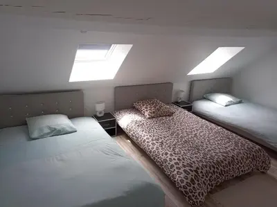 Un ou plusieurs lits dans un hébergement de l'établissement duplex agréable et calme