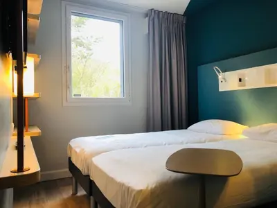 Un ou plusieurs lits dans un hébergement de l'établissement ibis budget Reims Parc Des Expositions