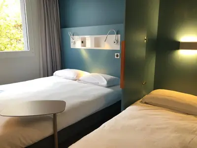 Un ou plusieurs lits dans un hébergement de l'établissement ibis budget Reims Parc Des Expositions