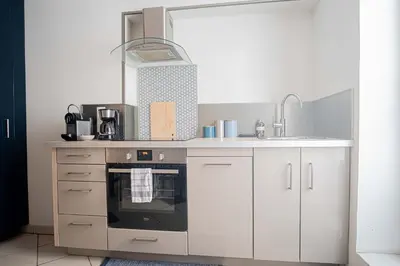 Cuisine ou kitchenette dans l'établissement TRIPLEX cathédrale parking gratuit