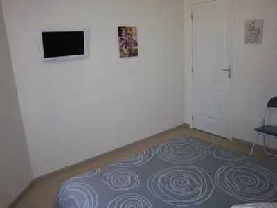 Télévision ou salle de divertissement dans l'établissement Hotel Le Colbert epernay