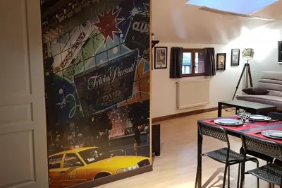 Coin salon dans l'établissement Ciné Loft 55 m2 Centre Ville