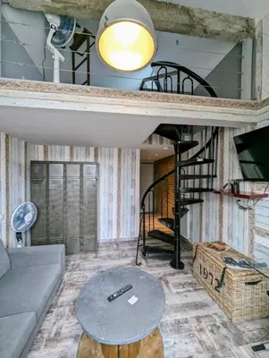 Coin salon dans l'établissement Chambres d'Hôtes La Filature