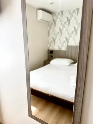 Un ou plusieurs lits dans un hébergement de l'établissement Brit Hotel Essentiel Reims Taissy