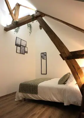 Un ou plusieurs lits dans un hébergement de l'établissement Gîte de l'Homme Blanc