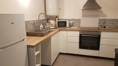 Cuisine ou kitchenette dans l'établissement Appartement au calme