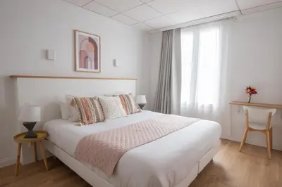 Un ou plusieurs lits dans un hébergement de l'établissement Hôtel Porte Mars - Reims Gare Centre Arena