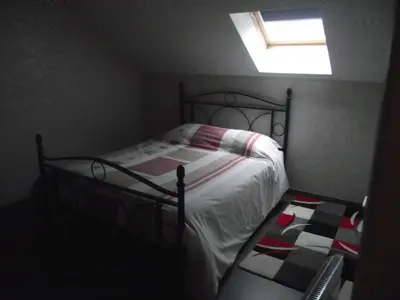 Un ou plusieurs lits dans un hébergement de l'établissement Maison chez Coco
