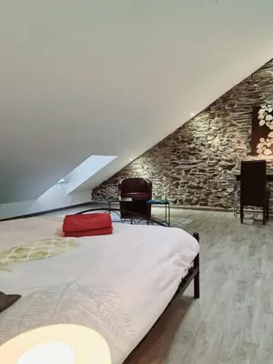 Un ou plusieurs lits dans un hébergement de l'établissement Gîte de vac’s et d’affaires à Monthermé