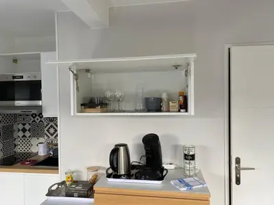 Cuisine ou kitchenette dans l'établissement Suite au Parc de Fresnoy