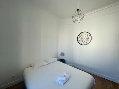 Un ou plusieurs lits dans un hébergement de l'établissement Charming Central Apartment - Reims