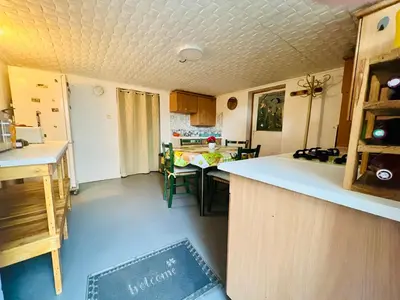 Cuisine ou kitchenette dans l'établissement Chambre en rez de jardin