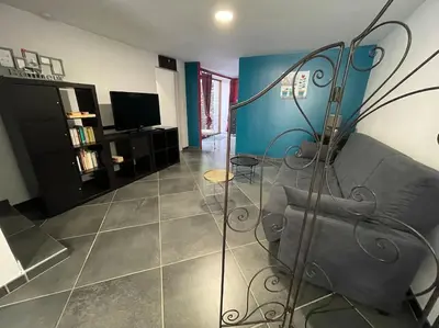 Télévision ou salle de divertissement dans l'établissement Logement du Paquis