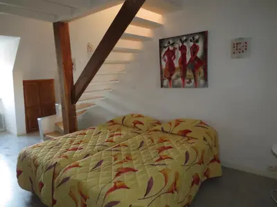 Un ou plusieurs lits dans un hébergement de l'établissement ApartHotel François 1er 16ème