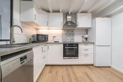 Cuisine ou kitchenette dans l'établissement Maison familiale 12 min Disneyland