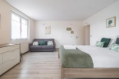 Un ou plusieurs lits dans un hébergement de l'établissement Maison familiale 12 min Disneyland