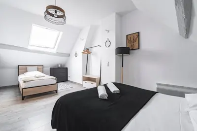 Un ou plusieurs lits dans un hébergement de l'établissement Maison familiale 12 min Disneyland