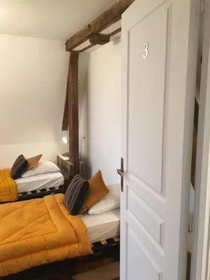 Un ou plusieurs lits dans un hébergement de l'établissement Villa bonne entente avec escape game