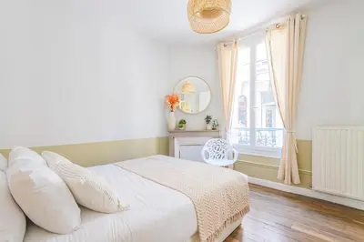 Un ou plusieurs lits dans un hébergement de l'établissement MM Suites Reims Centre Terasse