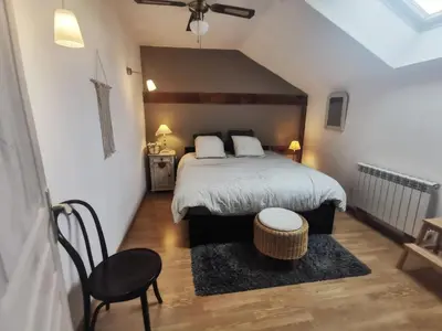 Un ou plusieurs lits dans un hébergement de l'établissement Gîte Cosy Green
