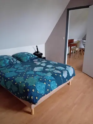 Un ou plusieurs lits dans un hébergement de l'établissement Chambre de la Vigne