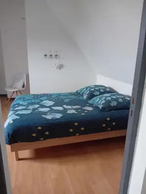 Un ou plusieurs lits dans un hébergement de l'établissement Chambre de la Vigne