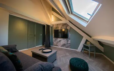 Télévision ou salle de divertissement dans l'établissement Gîte Mise au Vert