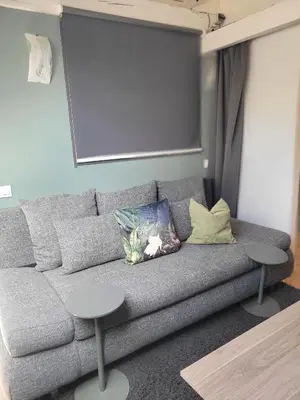 Coin salon dans l'établissement Gîte Mise au Vert