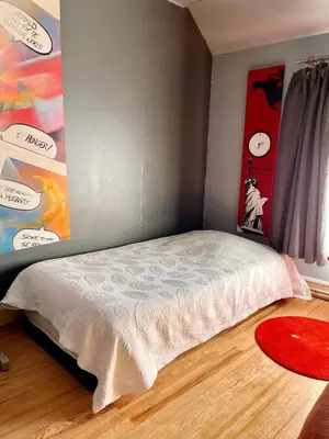 Un ou plusieurs lits dans un hébergement de l'établissement Maison charmante à La Croix-sur-Ourcq avec jardin clôturé