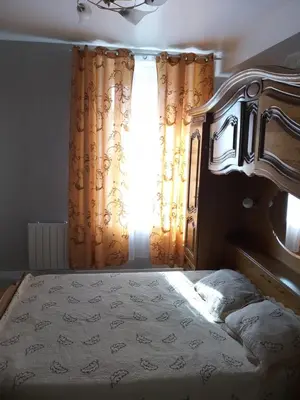 Un ou plusieurs lits dans un hébergement de l'établissement Bel petit appartement
