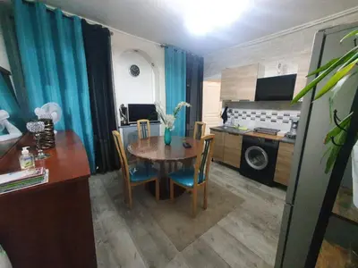 Cuisine ou kitchenette dans l'établissement Bel petit appartement