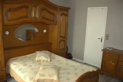 Un ou plusieurs lits dans un hébergement de l'établissement Bel petit appartement