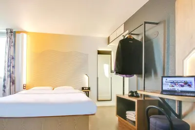 Un ou plusieurs lits dans un hébergement de l'établissement B&B HOTEL Reims Bezannes